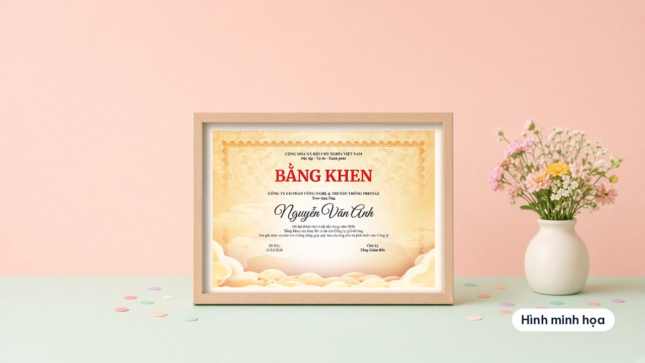Traditional bronze drum certificate of merit with a yellow background in a wooden frame next to a flower vase